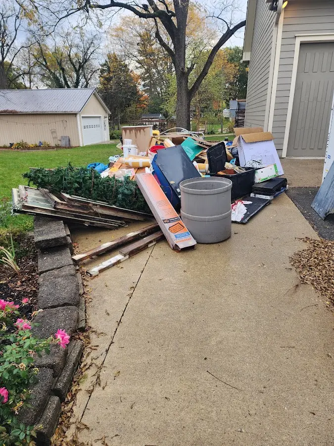 Dumpster being loaded with debris for Commercial Dumpster Rental in Tucumcari